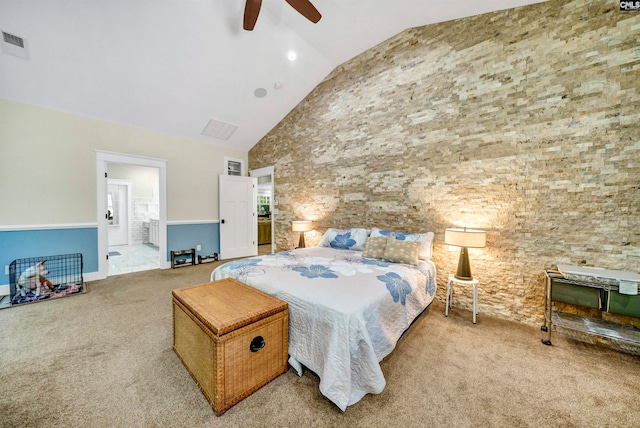 carpeted bedroom featuring high vaulted ceiling, ensuite bathroom, and ceiling fan