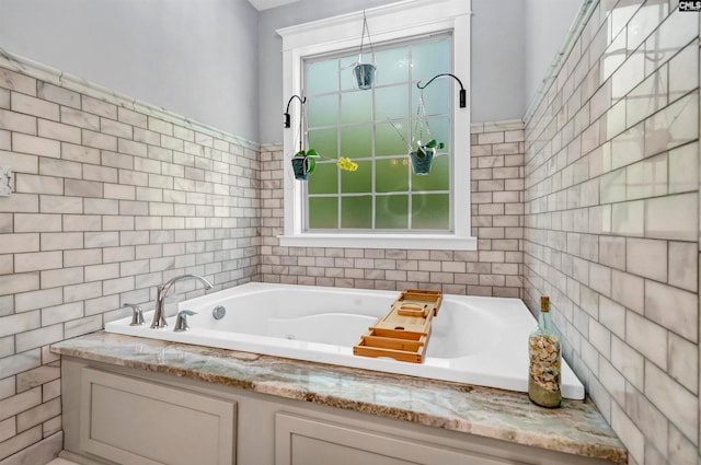 bathroom featuring a tub to relax in