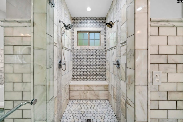 bathroom with a tile shower