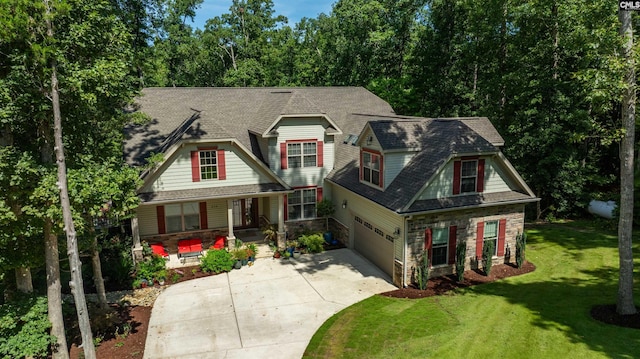 craftsman-style house with a garage and a front yard