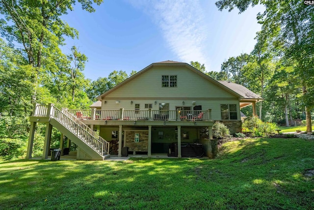 back of house with a yard and a wooden deck