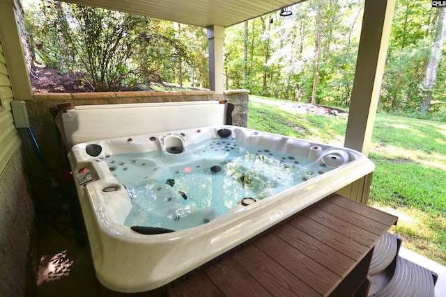 wooden terrace with an outdoor hot tub