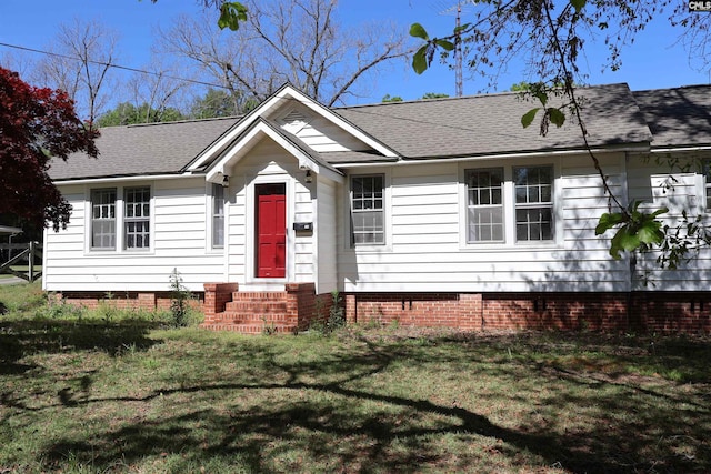 view of front facade with entry steps, a front lawn, roof with shingles, and crawl space