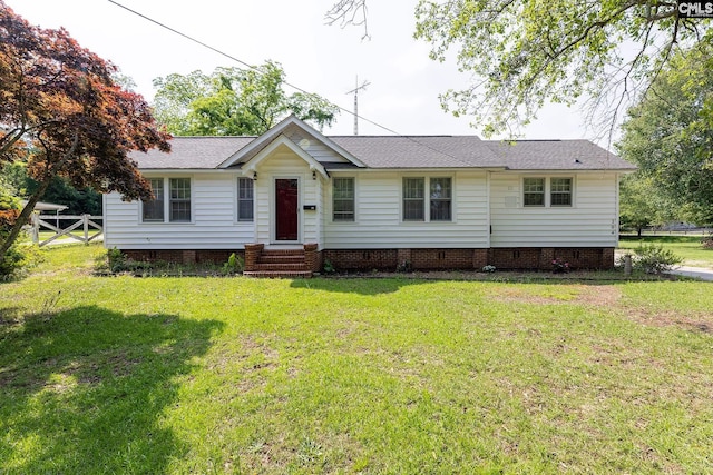 ranch-style home featuring a front lawn