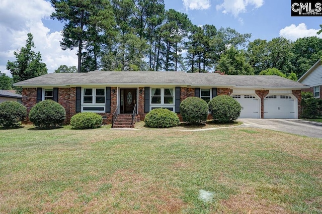 single story home featuring a garage and a front lawn