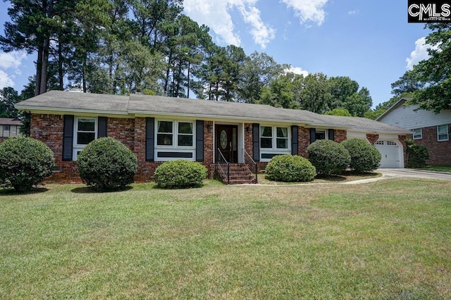 ranch-style home featuring a garage and a front lawn