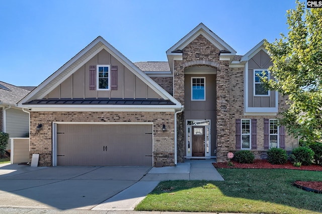 view of front facade featuring a garage and a front lawn