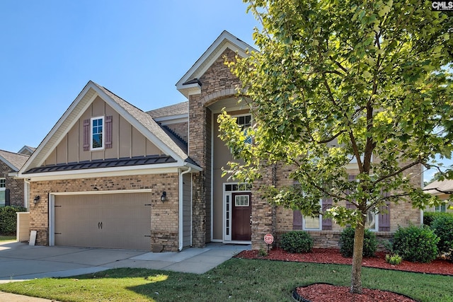 craftsman inspired home featuring a front yard and a garage