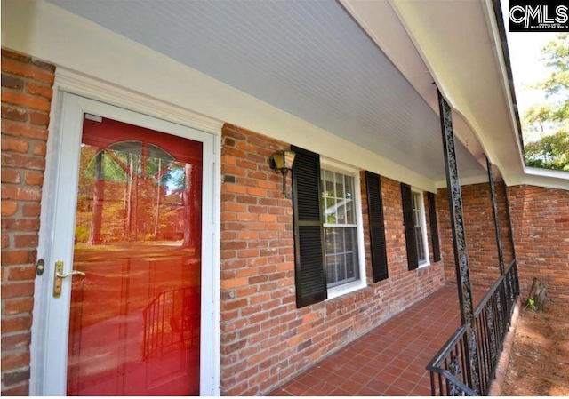 entrance to property with covered porch