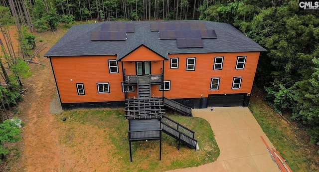 205 Miles Oak Ln, Blythewood, SC 29016 - exterior space featuring stairs, driveway, and roof mounted solar panels