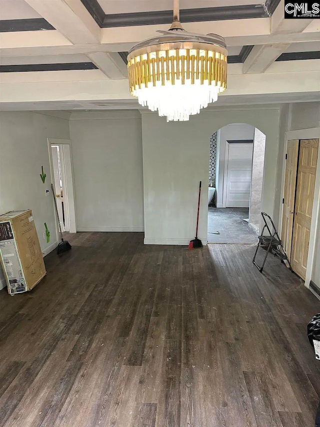 unfurnished dining area featuring beamed ceiling, coffered ceiling, and dark wood-type flooring