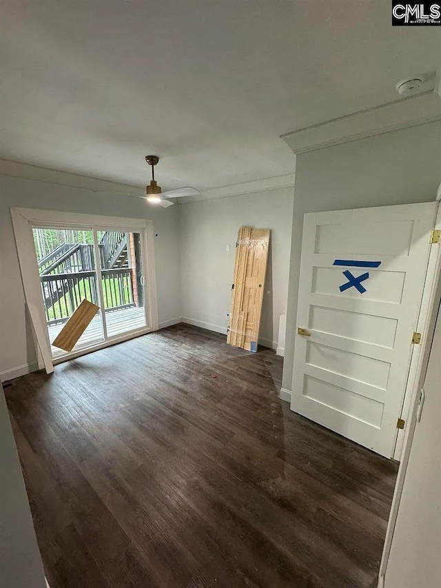 205 Miles Oak Ln, Blythewood, SC 29016 - spare room featuring dark wood-type flooring, baseboards, and a ceiling fan