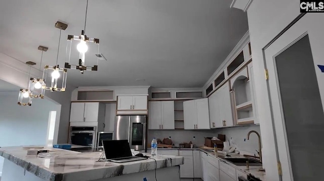 205 Miles Oak Ln, Blythewood, SC 29016 - kitchen featuring open shelves, a sink, appliances with stainless steel finishes, white cabinetry, and pendant lighting