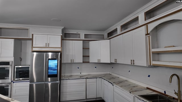 205 Miles Oak Ln, Blythewood, SC 29016 - kitchen with open shelves, a sink, ornamental molding, appliances with stainless steel finishes, and light stone countertops