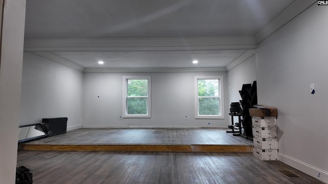 living room featuring ornamental molding and dark hardwood / wood-style flooring