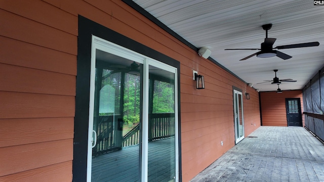 exterior space featuring ceiling fan