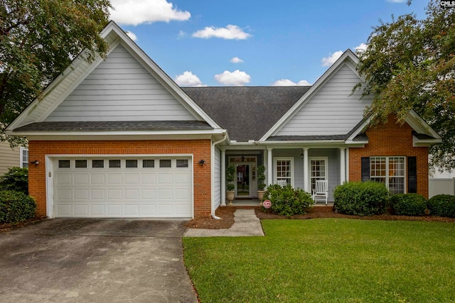 view of front facade with a front yard and a garage