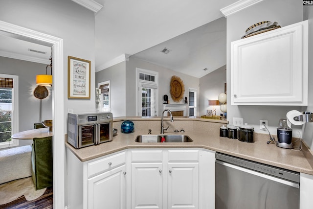 kitchen with white cabinetry, crown molding, dishwasher, and sink