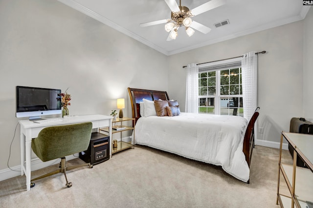 bedroom with ceiling fan, crown molding, and light colored carpet