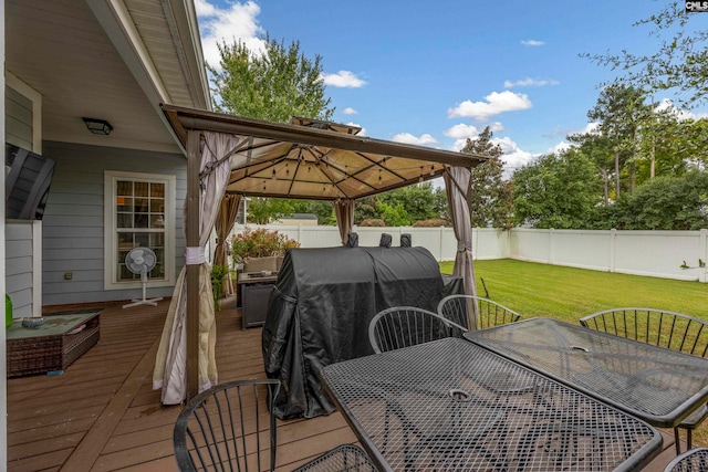 deck featuring a yard and a gazebo