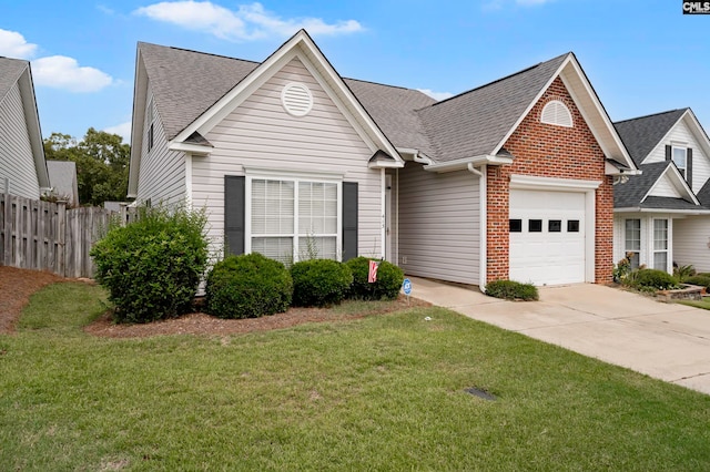 view of front of house featuring a front lawn and a garage