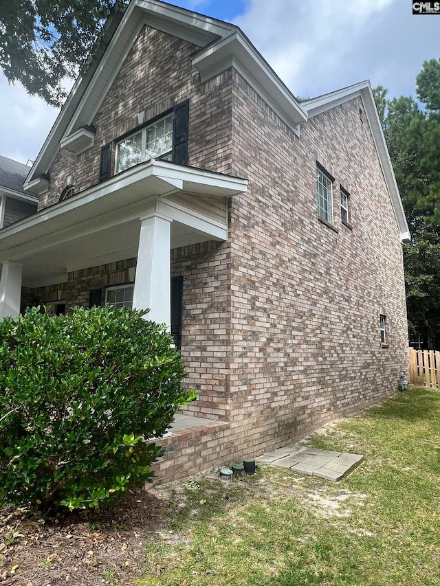 view of home's exterior featuring a yard