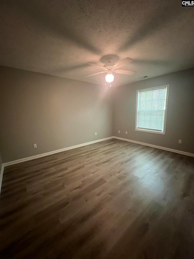 spare room featuring a textured ceiling, ceiling fan, and hardwood / wood-style flooring