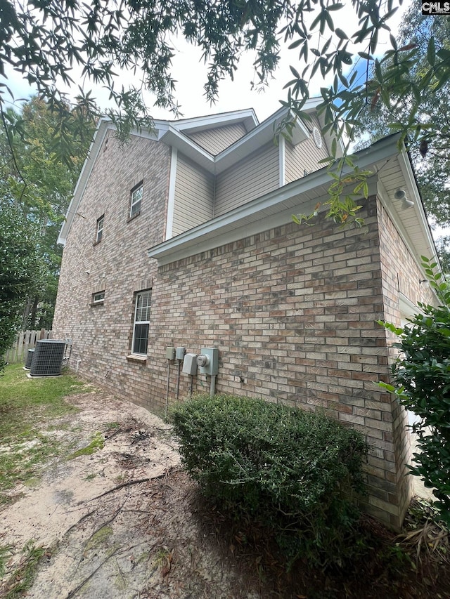 view of side of property with central AC unit