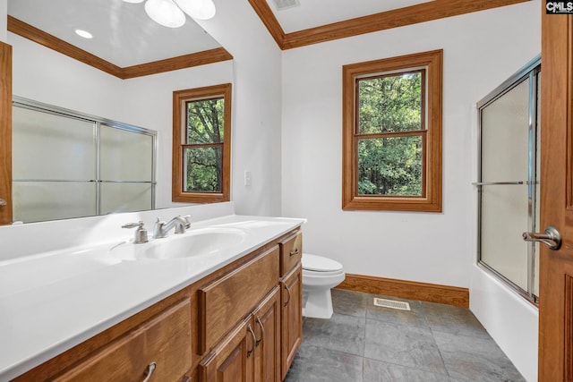 full bathroom with toilet, a wealth of natural light, ornamental molding, and vanity