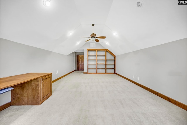 bonus room with light colored carpet, lofted ceiling, and ceiling fan