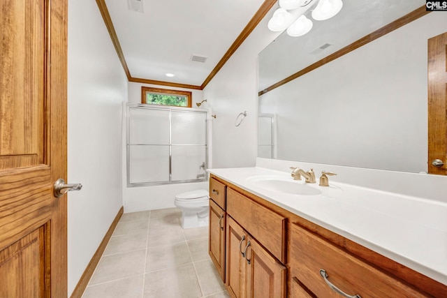 full bathroom featuring vanity, bath / shower combo with glass door, toilet, ornamental molding, and tile patterned floors