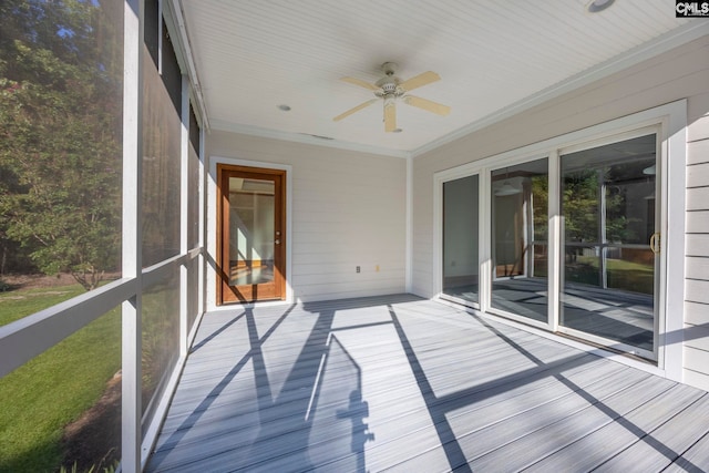 unfurnished sunroom with ceiling fan and plenty of natural light