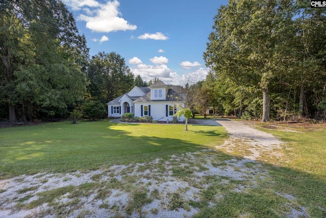 cape cod-style house with a front yard