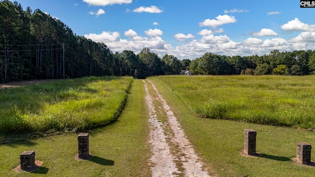 view of community featuring a lawn