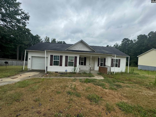 ranch-style house featuring a porch, a garage, and a front lawn