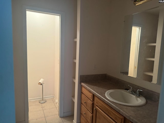 bathroom featuring tile patterned flooring and vanity