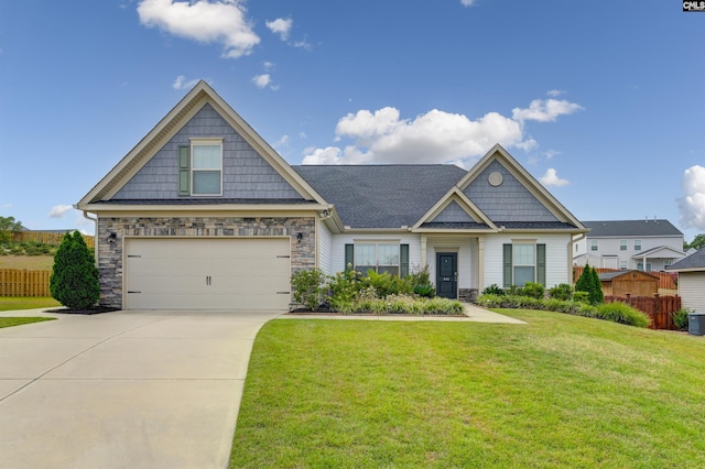 craftsman-style house with a garage and a front yard