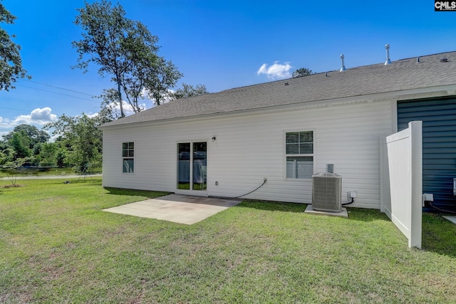 back of house featuring a yard, a patio, and cooling unit