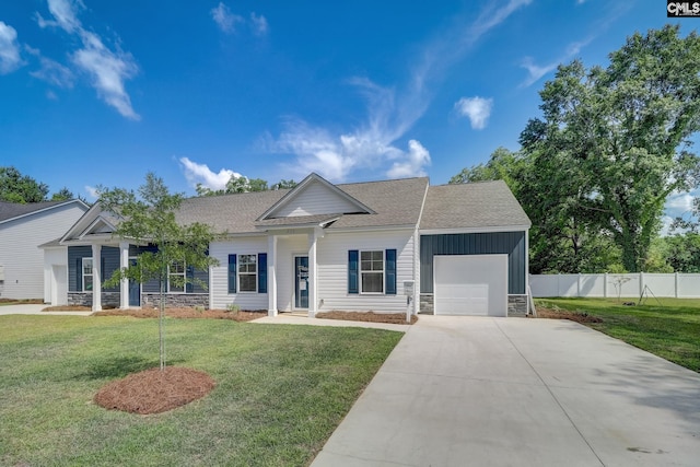 view of front of house featuring a front yard and a garage