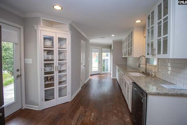 kitchen featuring dishwasher, dark hardwood / wood-style flooring, light stone counters, sink, and white cabinets