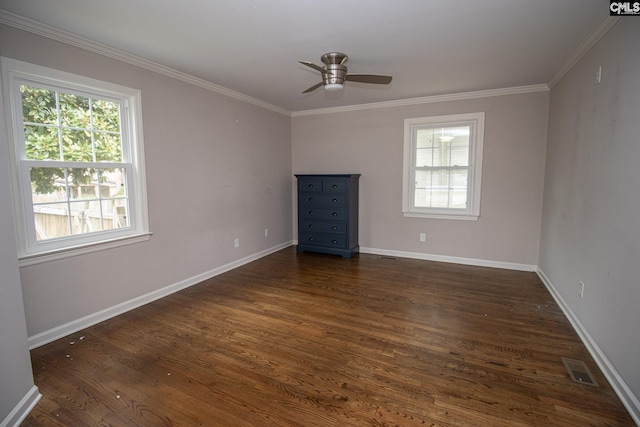 unfurnished living room with ceiling fan, dark hardwood / wood-style flooring, crown molding, and a healthy amount of sunlight