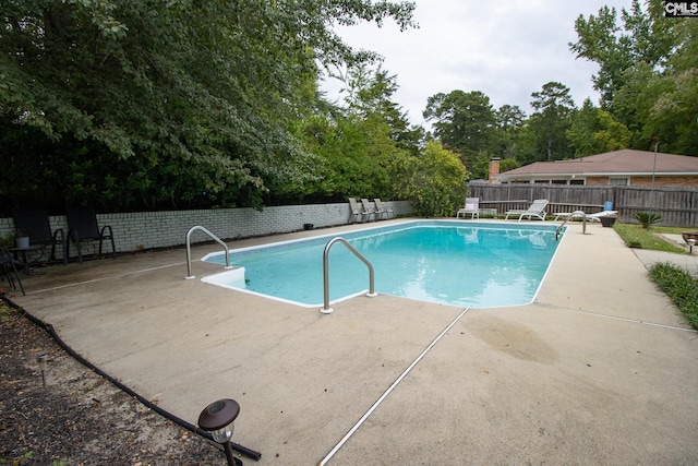 view of pool featuring a patio