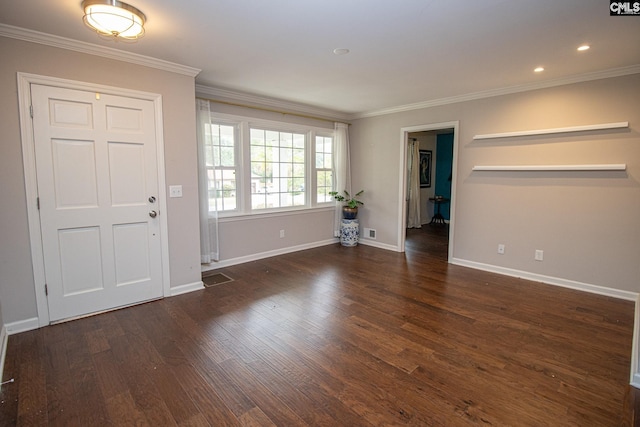 entrance foyer with ornamental molding and dark hardwood / wood-style floors