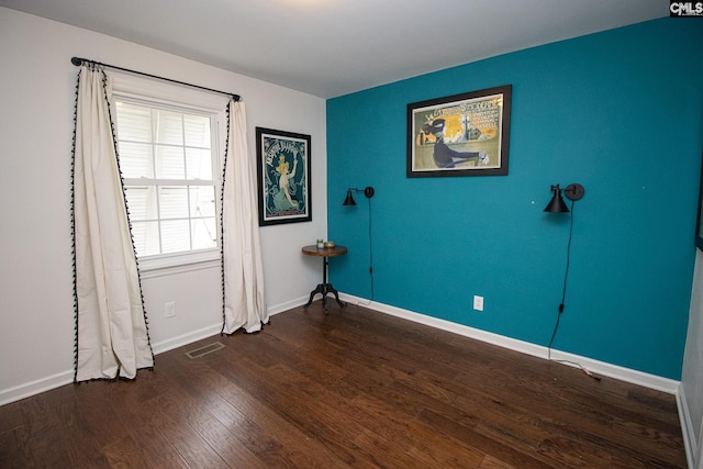 empty room featuring dark hardwood / wood-style floors