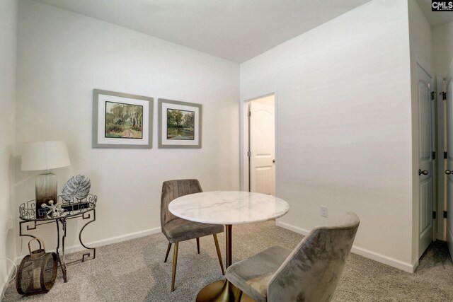 view of carpeted dining area