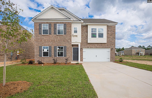 view of front of home with a garage and a front lawn