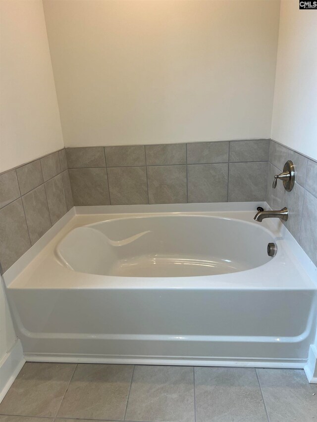 bathroom featuring a tub and tile patterned floors