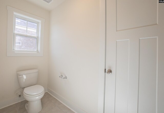 bathroom featuring toilet and tile patterned floors