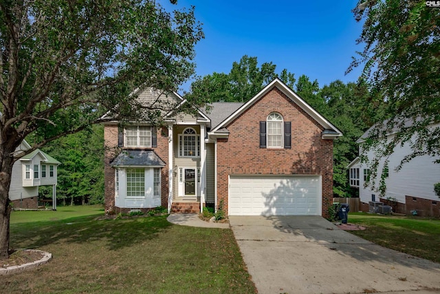 view of front property featuring a front yard and a garage