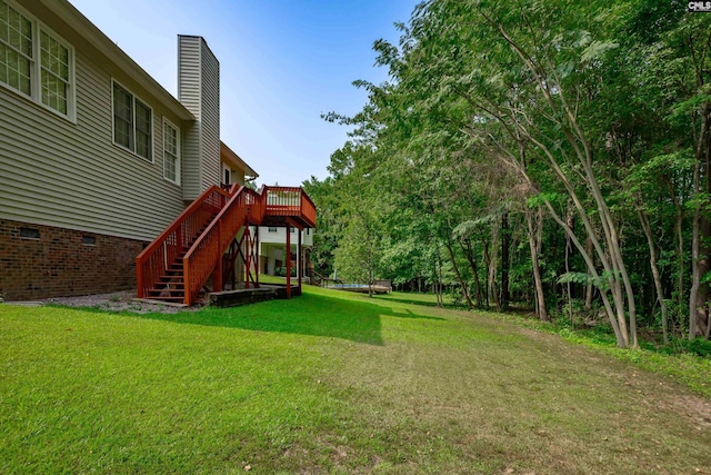 view of yard featuring a wooden deck